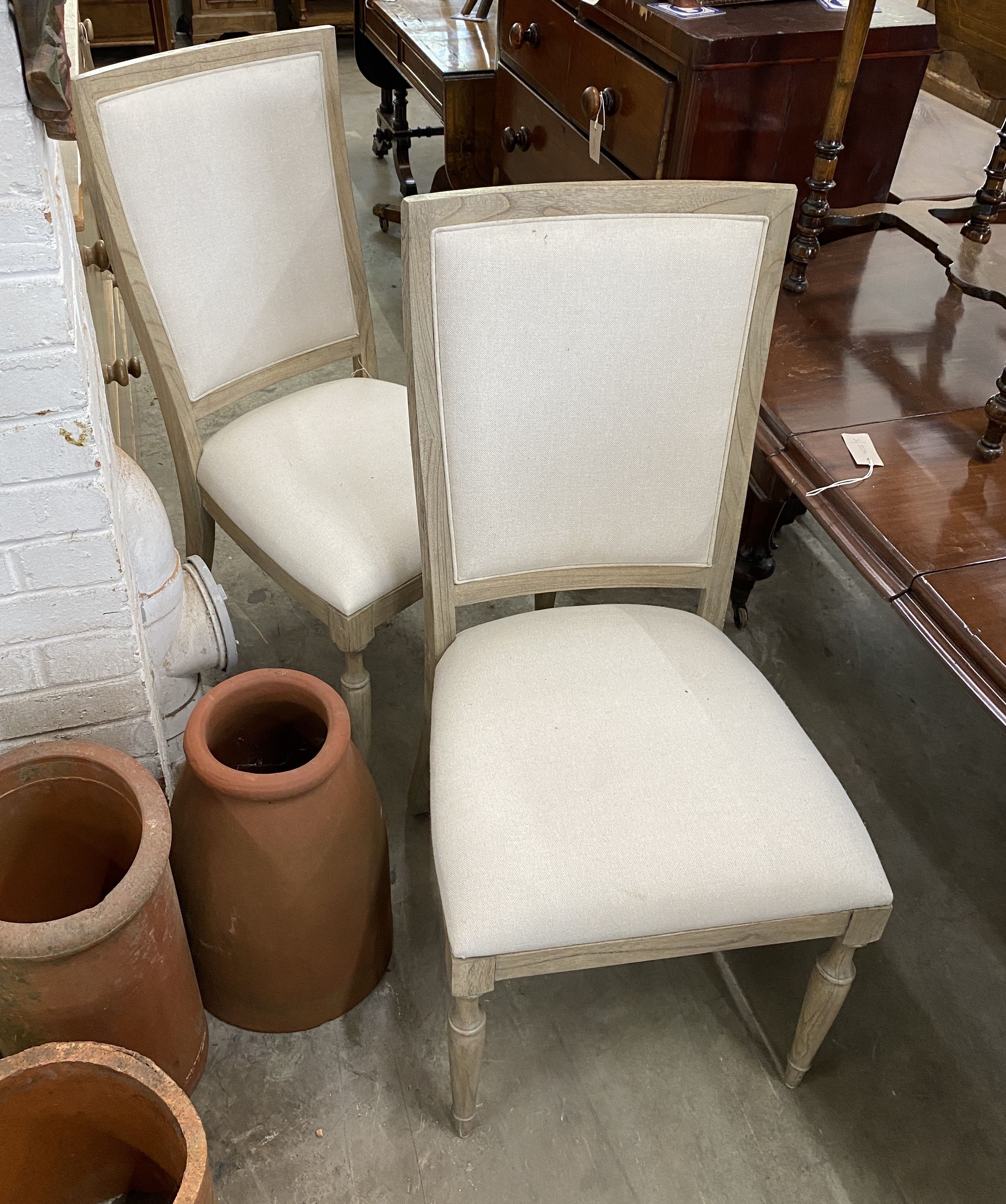 A pair of contemporary bleached oak “Riviera” upholstered high back dining chairs